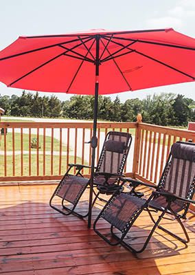 Peaceful RV sites surrounded by trees at Queen & Duke RV Resort in Whitesboro, Texas