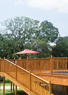 Peaceful RV sites surrounded by trees at Queen & Duke RV Resort in Whitesboro, Texas